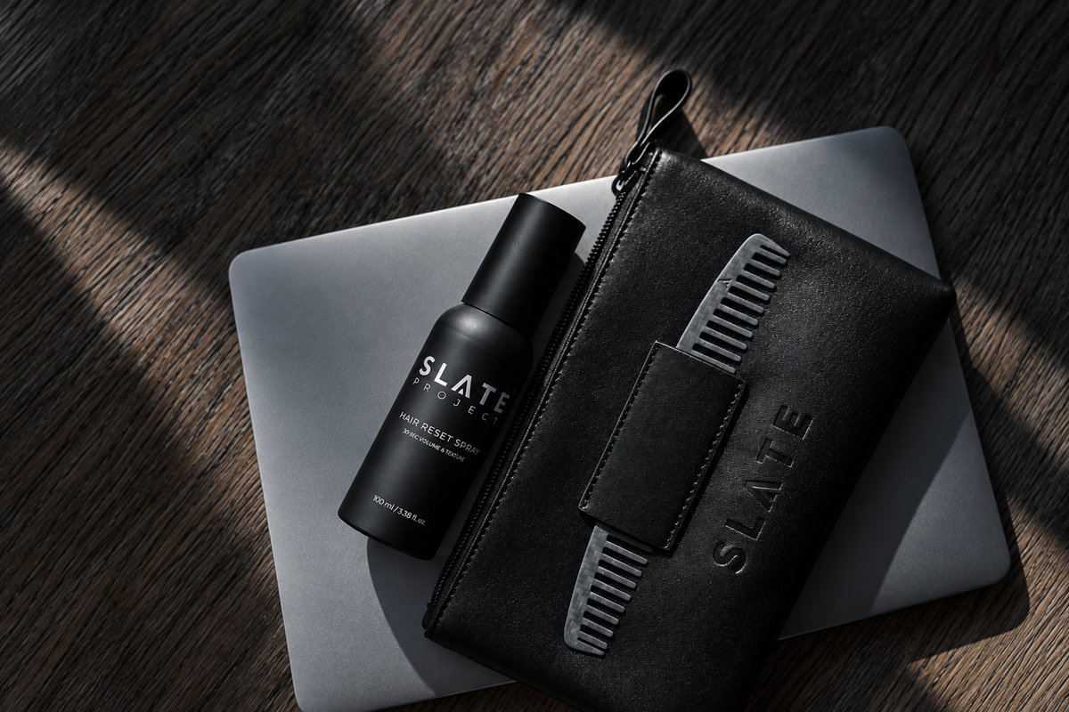 SLATE Complete Reset System arranged on a dark desk with Hair Reset Spray and black grooming tools.