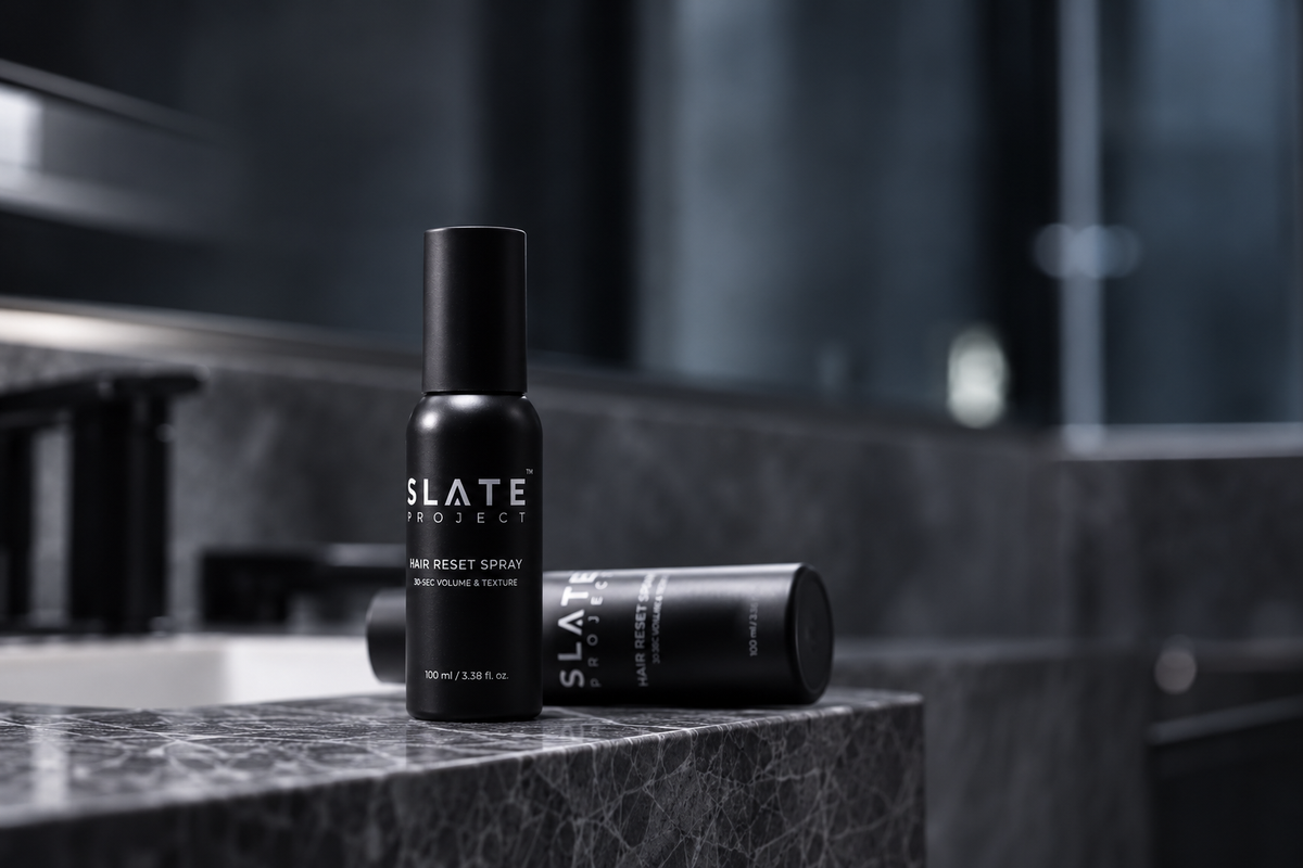 SLATE Hair Reset Spray on a dark bathroom vanity.